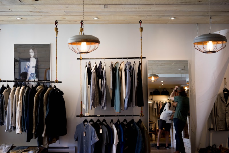 A selection of considered everyday garments on a clothing rack